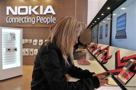 A girl tests out the new mobile phone at the Nokia Flagship store in Helsinki