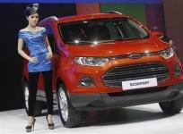 a-model-poses-beside-a-ford-ecosport-during-a-media-presentation-of-the-34th-bangkok-international-motor-show-in-bangkok-march-26-2013