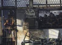 prisoners-stand-inside-the-burned-tanjung-gusta-prison-which-was-set-ablaze-by-inmates-after-a-riot-broke-out-in-medan-in-north-sumatra-province-reuters