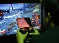 a-man-tries-a-game-at-the-nvidia-shield-pc-game-streaming-exhibit-at-e3-the-electronic-entertainment-expo-in-los-angeles-california-june-11-2013-credit-reuters-david-mcnew-files