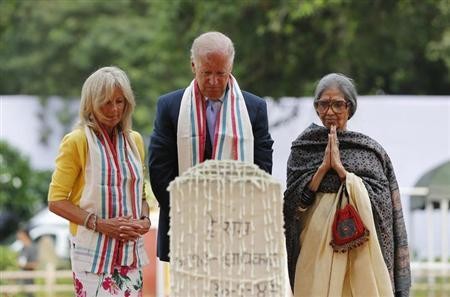 U.S. Vice President Joe Biden (C), his wife Jill (L), and Tara Gandhi, the granddaughter of Mahatma Gandhi, pay homage at the Mahatma Gandhi memorial at Gandhi Smriti, in New Delhi July 22, 2013. (Reuters)