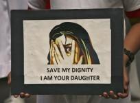 A schoolgirl holds a placard (representational image)