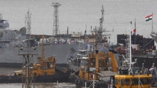 Ships and a submarine belonging to the Indian Navy are seen docked at the naval dockyard in Mumbai.