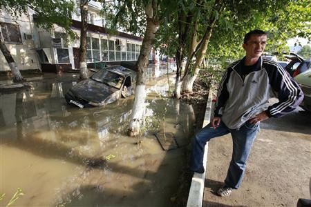 (Representational image) A local resident stands near a damaged car stuck in a flooded street in the town of Krymsk in Krasnodar region, southern Russia, July 8, 2012.