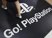 a-woman-walks-on-a-floor-advertisement-for-sony-corp039s-playstation-3-game-console-at-an-electronic-store-in-tokyo-april-27-2011-reuters-yuriko-nakao