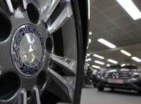 a-company-logo-is-seen-on-a-wheel-in-front-of-mercedes-benz-a-class-cars-displayed-in-a-dealership-of-german-car-manufacturer-daimler-in-paris-reuters