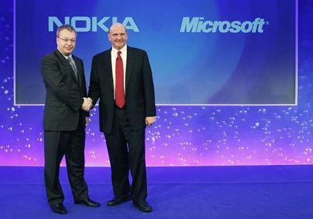 Nokia chief executive Stephen Elop (L) welcomes Microsoft chief executive Steve Ballmer with a handshake at a Nokia event in London in this February 11, 2011 file photograph.