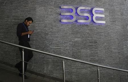 An employee walks out of the Bombay Stock Exchange (BSE) building in Mumbai August 22, 2013. An employee walks out of the Bombay Stock Exchange (BSE) building in Mumbai August 22, 2013.