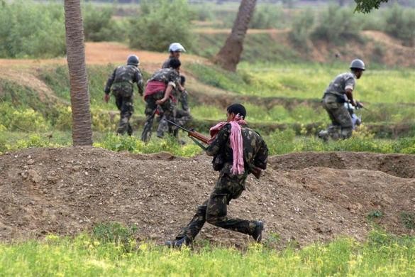 (Representational image) Paramilitary forces take cover during a gunfight with Maoists in Lalgarh.