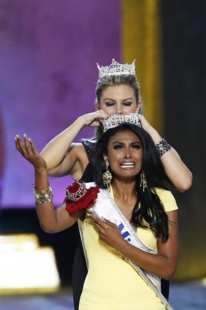 Miss America contestant, Miss New York Nina Davuluri reacts as she is chosen as winner of the 2014 Miss America Pageant in Atlantic City, New Jersey Nina Davuluri