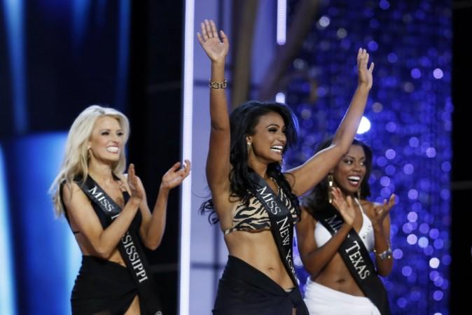 Miss America 2014 contestant, Miss New York Nina Davuluri reacts as she is chosen to move on while competing in the Miss America Pageant in Atlantic City, New Jersey Nina Davuluri