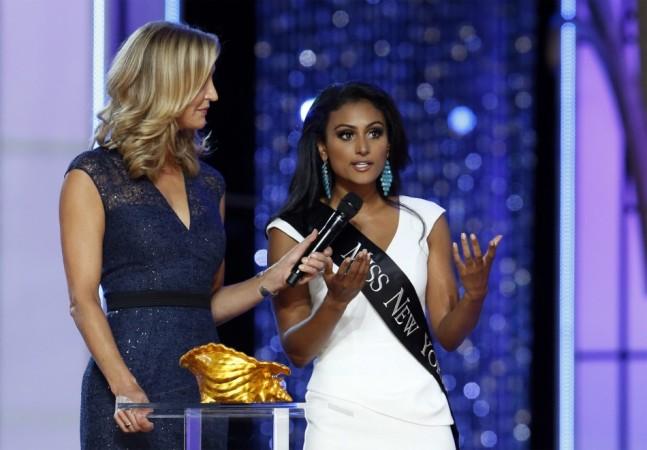 Miss America contestant, Miss New York Nina Davuluri answers a question from host Lara Spencer during the 2014 Miss America Pageant in Atlantic City, New Jersey Nina Davuluri
