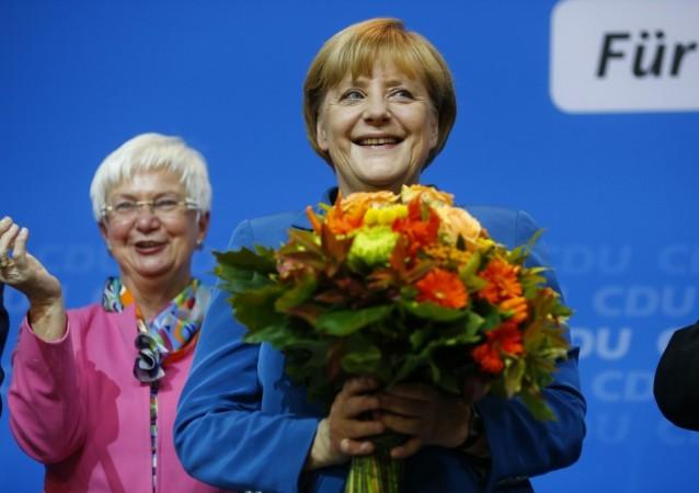 German Chancellor and leader of the Christian Democratic Union (CDU) Angela Merkel receives flowers. Angela Merkel flowers