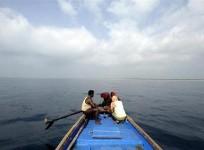 Fishermen in a boat in Bay of Bengal