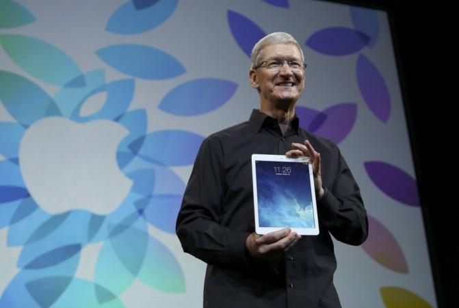 Apple Inc CEO Tim Cook holds up the new iPad Air during an Apple event in San Francisco Apple iPad Air