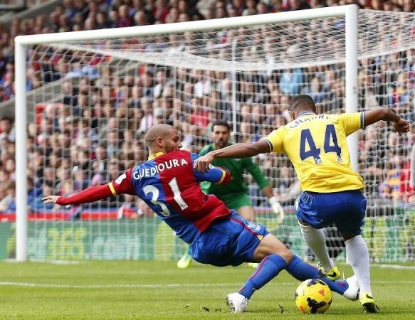 Arsenal winger Serge Gnabry is brought down by Crystal Palace forward Adlene Guedioura. Reuters Gnabry Arsenal