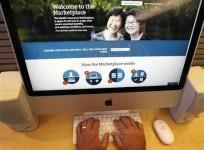a-man-looks-over-the-affordable-care-act-commonly-known-as-obamacare-signup-page-on-the-healthcare-gov-website-in-new-york-in-this-october-2-2013-photo-illustration
