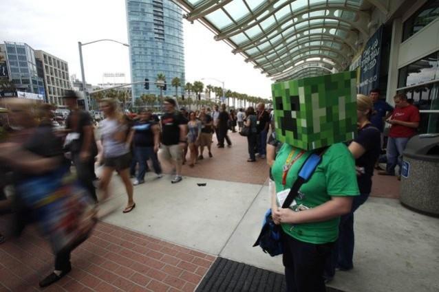 A woman is seen dressed up as the character Minecraft