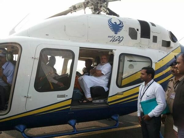 Gujarat CM Narendra Modi in a chopper while on his way to meet victims of Patna serial bomb blasts