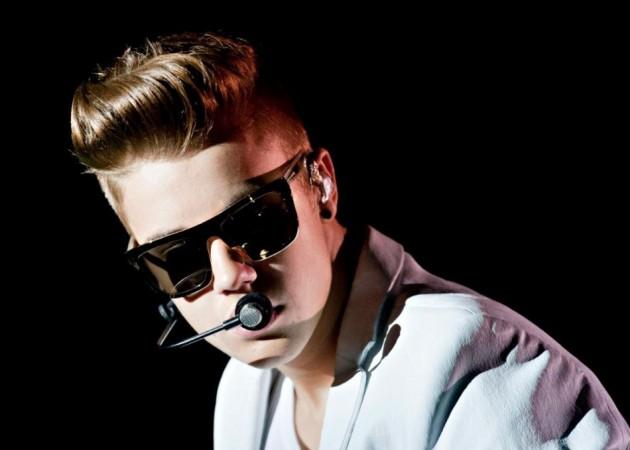 Justin Bieber was pictured leaving a Brazilian brothel covered in a sheet.(Reuters)