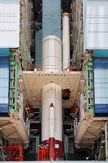 7 The strap on being lowered to its position during vehicle integration 7 The strap on being lowered to its position during vehicle integration
