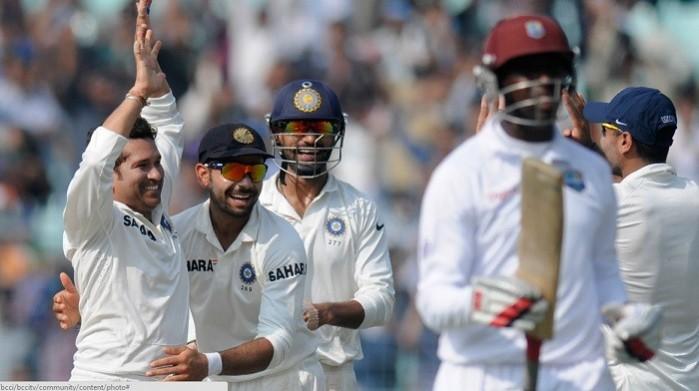 Sachin Tendulkar celebrates with teammates after picking up the wicket of West Indies batsman Shane Shillingford. BCCI Official Website Sachin Tendulkar India