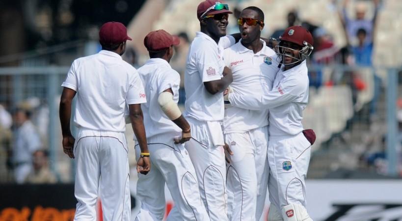 West Indies spinner Shane Shillingford celebrates with teammates after dismissing India opener Murali Vijay. BCCI Official Website Shillingford West Indies
