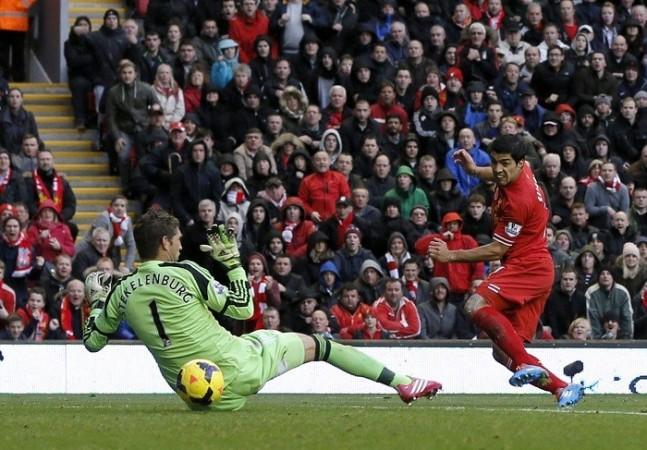 Liverpool striker Luis Suarez slots past Fulham goalkeeper Maarten Stekelenburg. Reuters Liverpool Luis Suarez Stekelenburg
