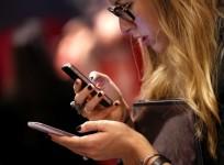 a-consumer-checks-out-smartphones-reuters