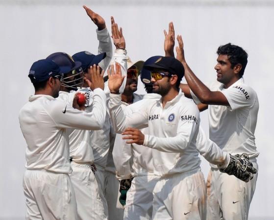 R Ashwin celebrates with teammates after dismissing Darren Sammy. BCCI Ashwin Kohli India