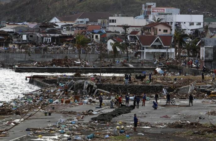 A row of body bags are laid out on the beach after super typhoon Haiyan battered Tacloban Typhoon Haiyan
