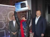 a-proud-owner-flaunts-his-sony-playstation-4-with-jack-tretton-r-president-and-ceo-of-sce-america-2013