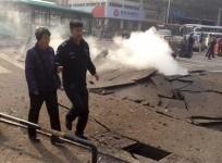 policeman-accompanies-a-woman-after-the-oil-pipeline-exploded-in-china