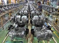 a-worker-assembles-an-engine-inside-the-royal-enfield-motorcycle-factory-in-chennai-april-6-2012
