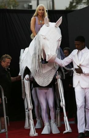 Musician Lady Gaga arrives with a mechanical horse at the 41st American Music Awards in Los Angeles Lady Gaga