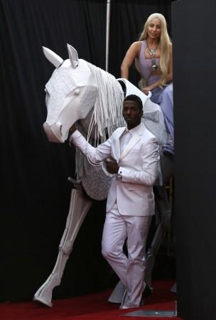 Musician Lady Gaga arrives with a mechanical horse at the 41st American Music Awards in Los Angeles Lady Gaga