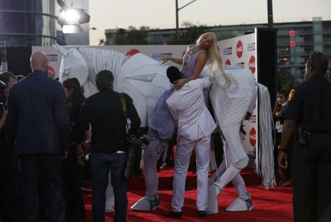Musician Lady Gaga arrives with a mechanical horse at the 41st American Music Awards in Los Angeles Lady Gaga