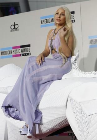 Musician Lady Gaga arrives on a mechanical horse at the 41st American Music Awards in Los Angeles, California, November 24, 2013. Musician Lady Gaga Arrives with a Mechanical Horse at the 41st American Music Awards in Los Angeles