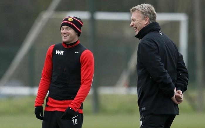 Wayne Rooney and Manchester United manager David Moyes share a laugh during a training session, November 26. Reuters Rooney Moyes Manchester United