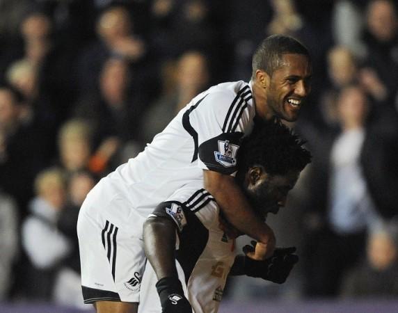 Swansea striker Wilfried Bony celebrates with Wayne Routledge after scoring against Stoke in their English Premier League game, November 10. Reuters Routledge Bony Swansea