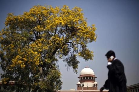 A lawyer walks past outside Indian Supreme Court