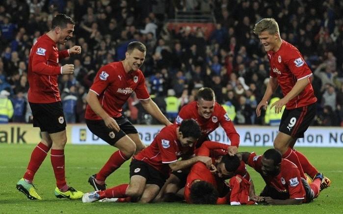 Cardiff players celebrate their equaliser against Manchester United. Reuters Cardiff