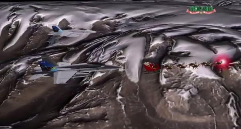 Santa's sled is escorted by a pair of fighter jets in this still image taken from an handout NORAD animated video