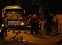 officials-stand-around-a-bus-with-a-smashed-windshield-following-a-riot-in-singapores-little-india-district-december-9-2013