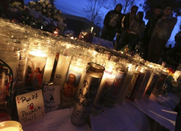 Fans gather near a makeshift shrine at an unofficial memorial event for Paul Walker