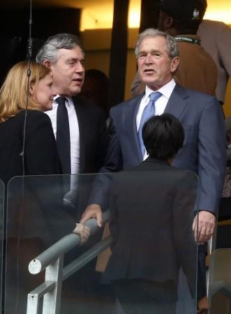 Former US president George W Bush (right) talks to former British prime minister Gordon Brown Bush Madiba Memorial