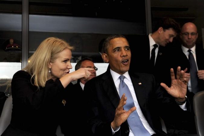 GCIS handout photo shows U.S. President Obama talking with Denmark's PM Thorning-Schmidt at the Memorial Service for Mandela in Johannesburg Barck Obama, Thorning Schmidt