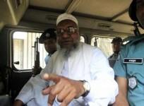 bangladeshs-jamaat-e-islami-leader-abdul-quader-mullah-gestures-as-he-talks-from-a-police-van-after-a-war-crimes-tribunal-sentenced-him-to-life-imprisonment-in-dhaka-in-this-file-photo-reuters