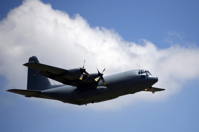 A C-130 transporting the coffin of Mandela takes off after a send-off ceremony in Pretoria Nelson Mandela