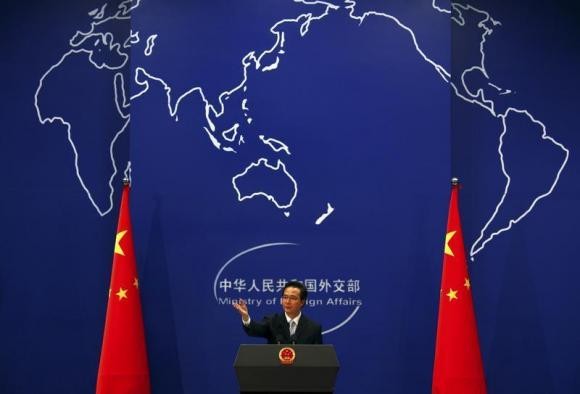 China's Foreign Ministry spokesman Hong Lei asks journalists for questions during a news conference in Beijing